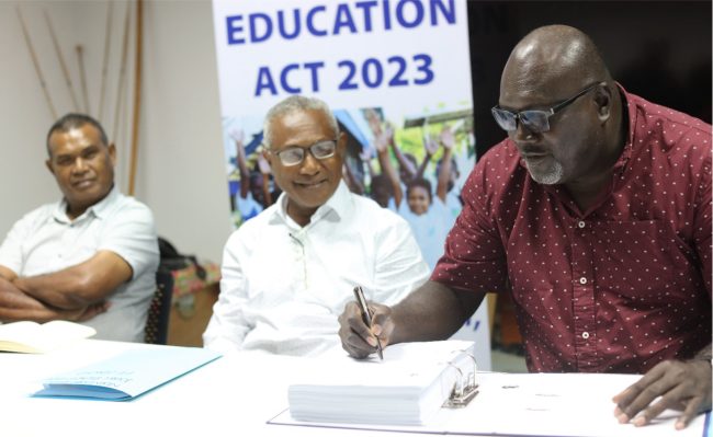 Minister Tozen Leokana signs off the release of the results.
