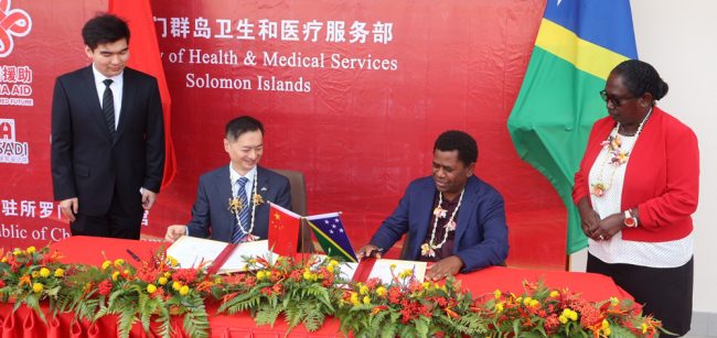 Signing of handover certificate by H.E Cai weiming and Minister Bosawai