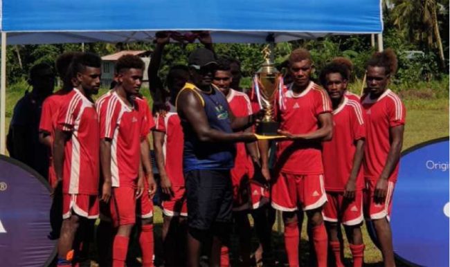 The major sponsor Kenwood Harry hands over the trophy to Rendova Devon Captain Alban