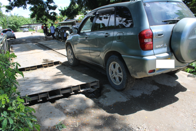 A vehicle crossing the bridge