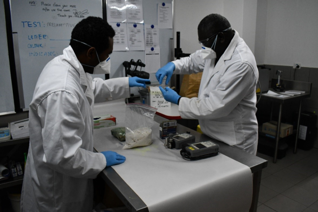 DC Frank Korai demonstrates Forensic Drug Investigation to DC Peter Vaiti