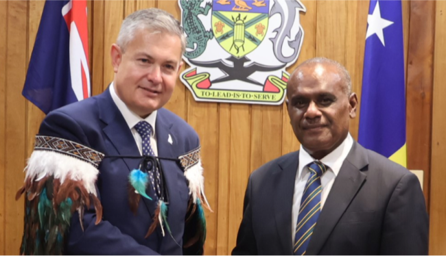 PM Manele welcomes H.E Curr with a handshake.
