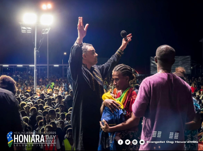 Bishop Dag Heward-Mills praying for a mother and her baby