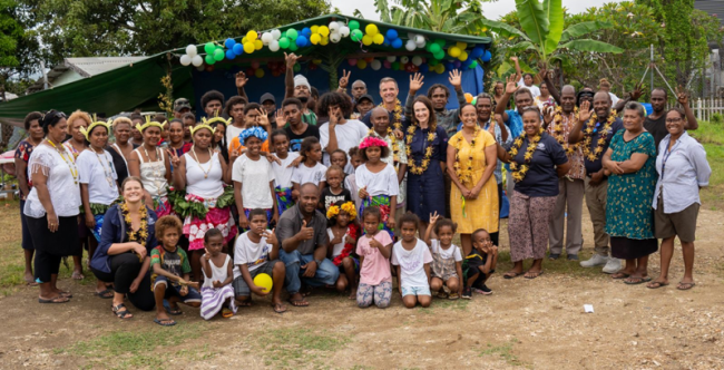 Community members celebrating the unveiling of the street lights