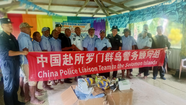 Handing over of uniforms by the chines police liason team
