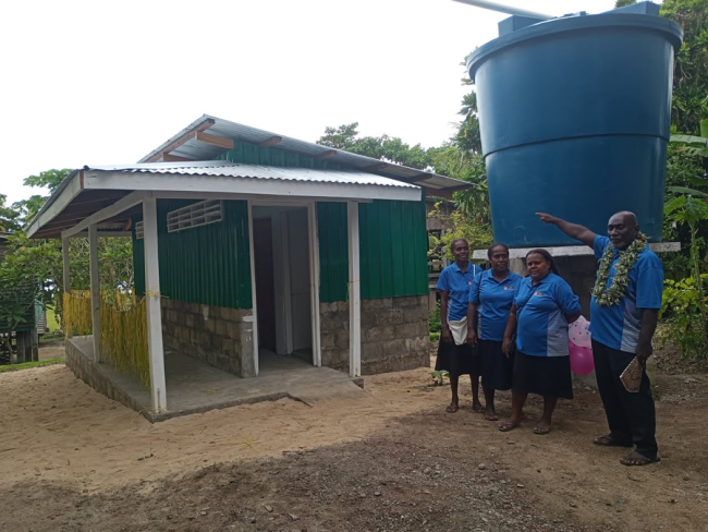 Headmaster Mr Dalton Runimetu with his three female teachers.