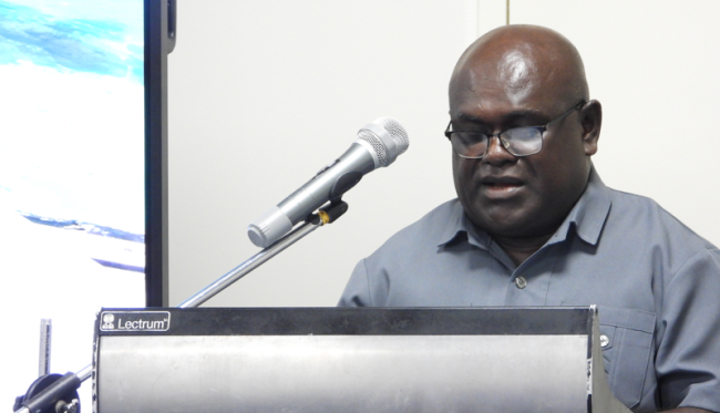 Minister Harry Kuma delivering his remarks