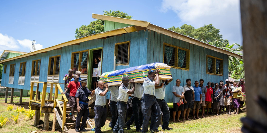 The casket of the late Sir Francis carried to the burial site at Koriovuku village