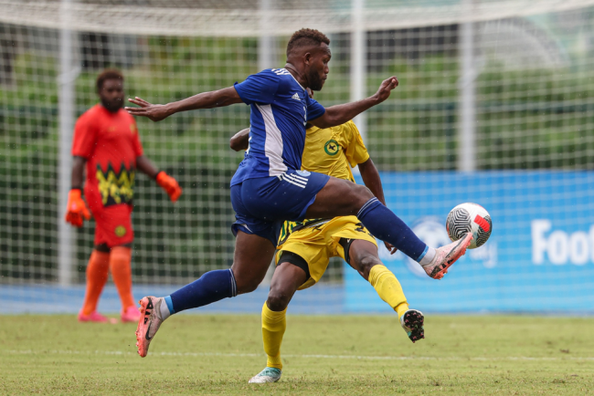 A Central Coast player attempts to go past an Ifira Blackbird player. Photo OFC