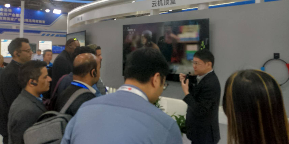 International journos at one of the exhibition booths