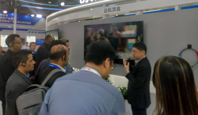 International journos at one of the exhibition booths