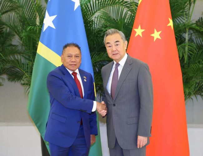 Foreign Minister Peter Shanel Agovaka and Chinese Foreign Minister Wang Yi