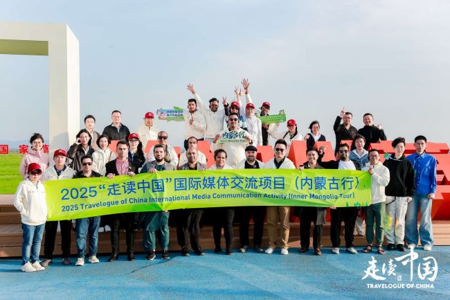 International journos and Travelogue of China representatives posing for a photo during a visit to the Chilechuan Grassland