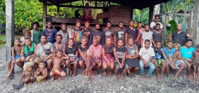 Members of the Alisuri Livelihood Association gather for a group photo in front of the cocoa drying facility in West Mbaelele, Malaita Province.
