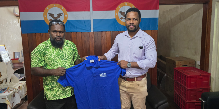 SICCI CEO, right, makes a presentation to the Malaita Premier