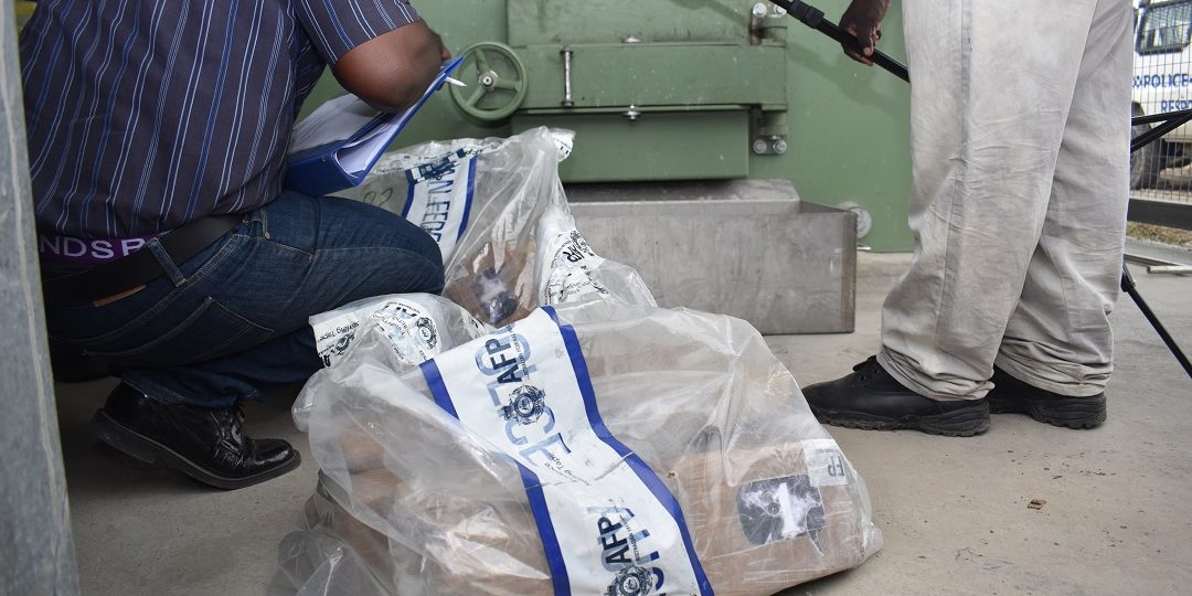 NCID officers preparing the cocaine for destruction