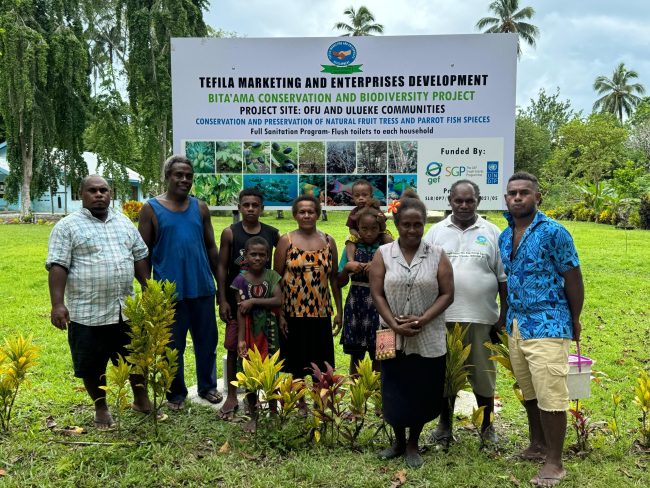 Ofu and Bitaama Conservation of Biodiversity project sign board with the community leaders Photo credit Daniel Gonzalez of UNDP
