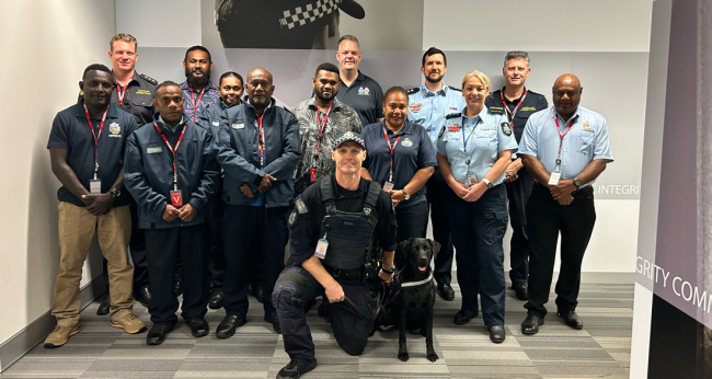 SI Delegation meet AFP Canine handler Leon SCHULZ and Chive (K9) whilst touring AFP Brisbane Airport Operations.