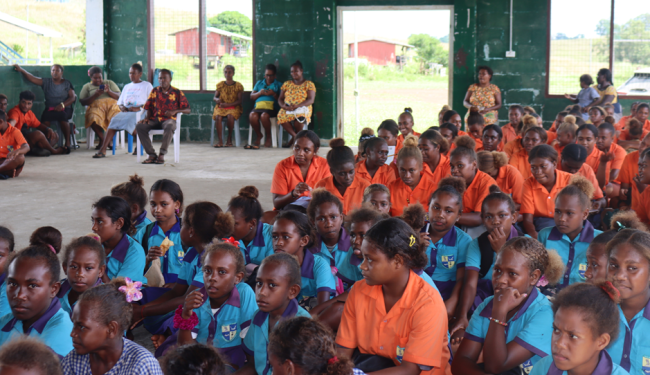 Students listening at the awareness