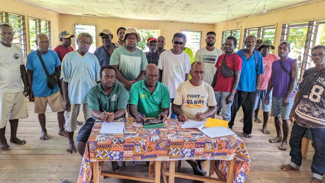 Tribal members witnessing the signing