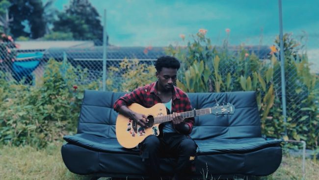 Izack with his guiter