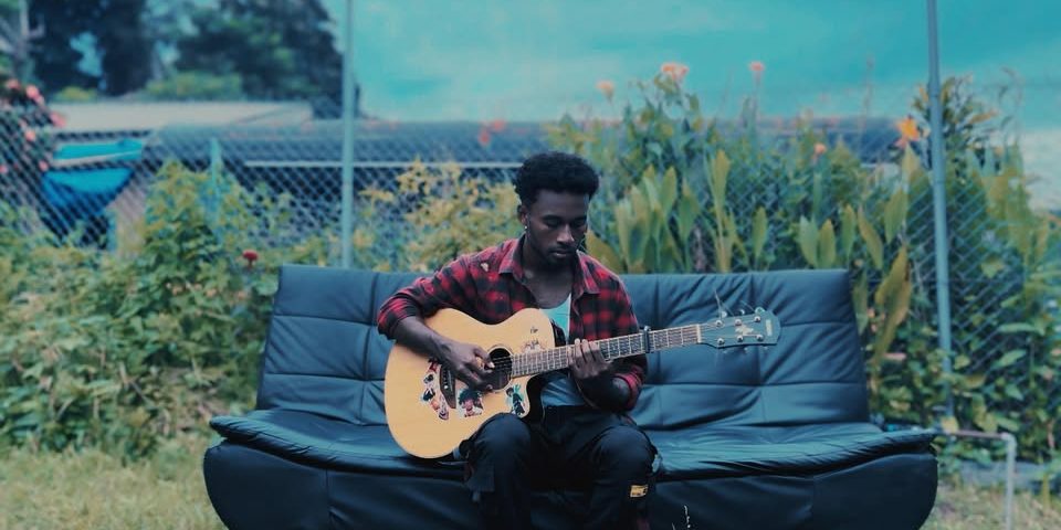 Izack with his guiter