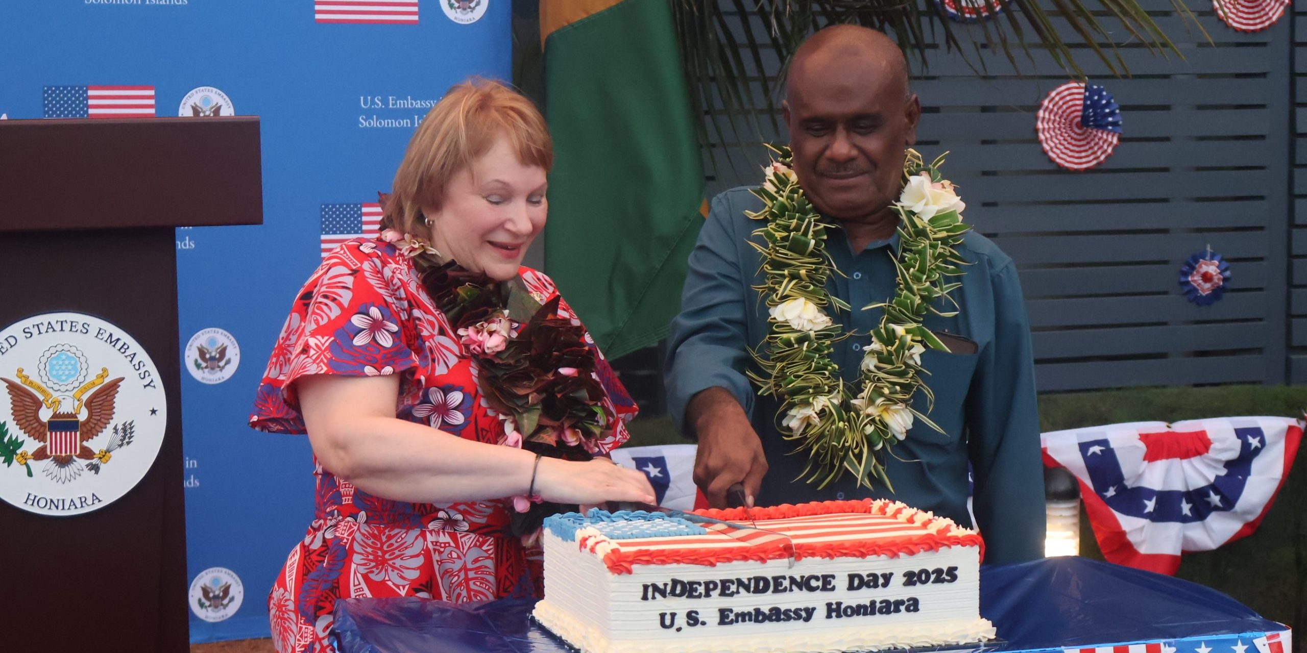 PM Manele and United States Ambassador to Papua New Guinea and Solomon Islands, Her Excellency Ann Marie Yastishock cutting the anniversary cake