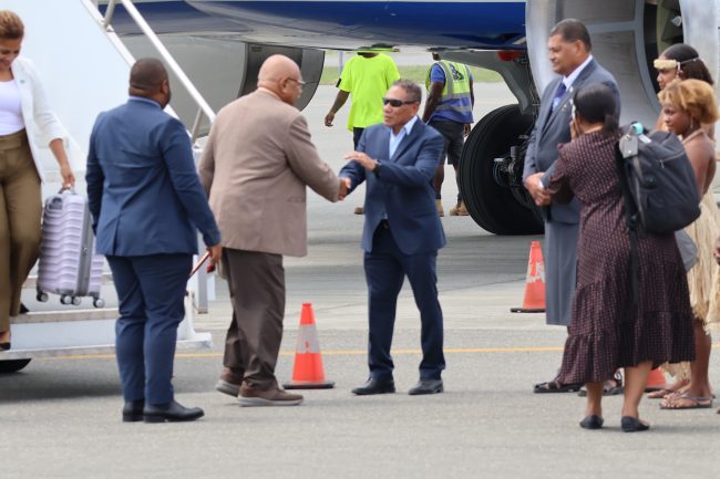 Foreign Affairs Minister, Hon. Peter Shanel Agovaka greeting Fiji Prime Minister, Hon. Sitiven Rabuka