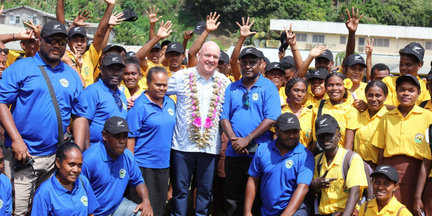 Honiara Senior High School students and teachers pose for a photo opportunity with New Zealand Prime Minister Hon. Luxon.