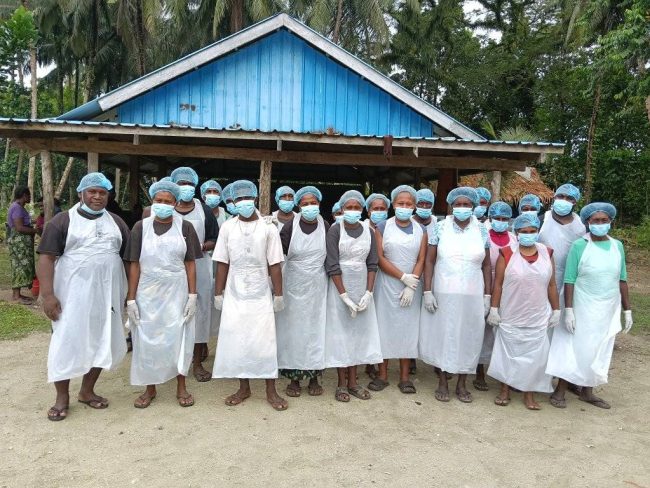 Participants engage in hands-on post-harvest handling practice.
