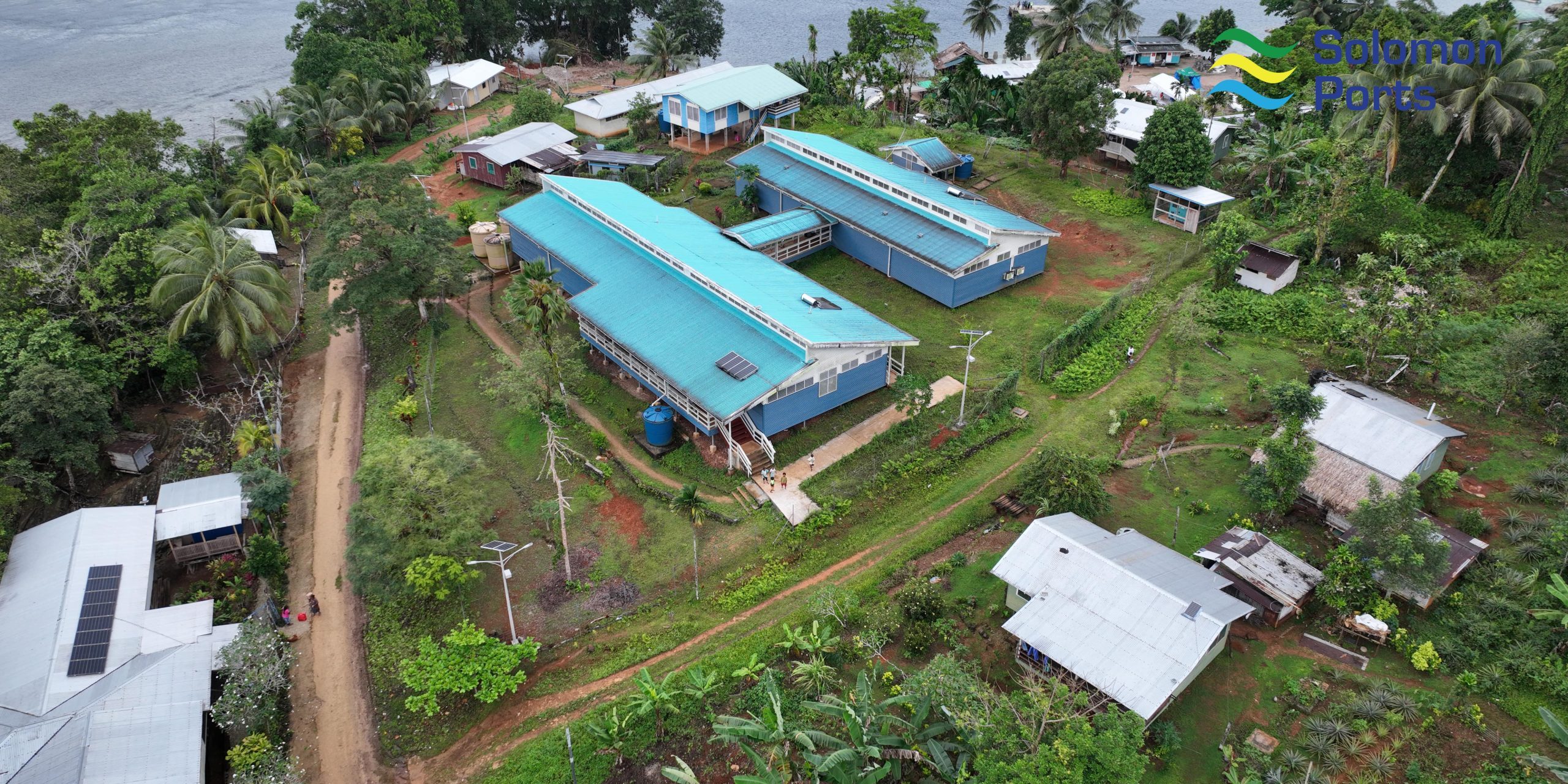 Aerial view of of Afio health centre sarrounded by solar street lights gifted by SIPA