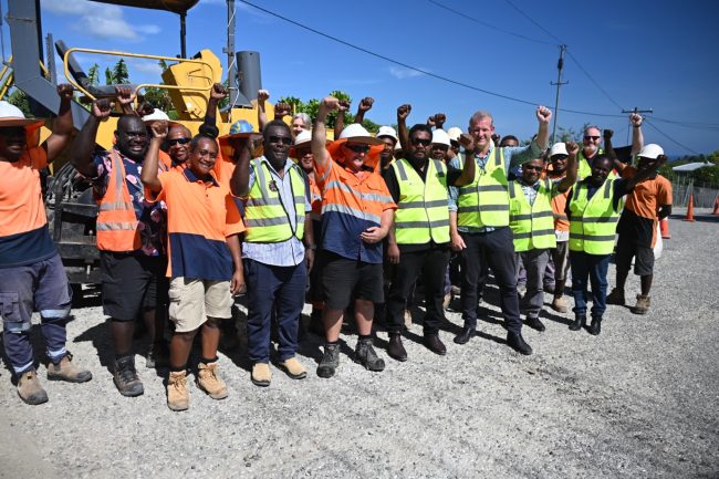 Contractors and representatives from Australia, Solomon Islands Government at the FFA Road junction at West Kolaridge – Repairs to the FFA road have employed 60 local workers