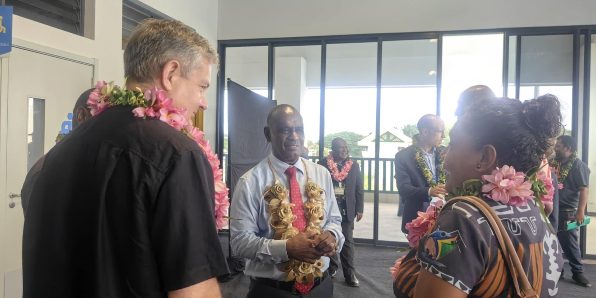 Prime Minister Jeremiah Manele, centre speaking to Minister of Women, Youths, Children and Family Affairs, Cathy Nori and New Zealand High Commissioner, Jonathan Curr.