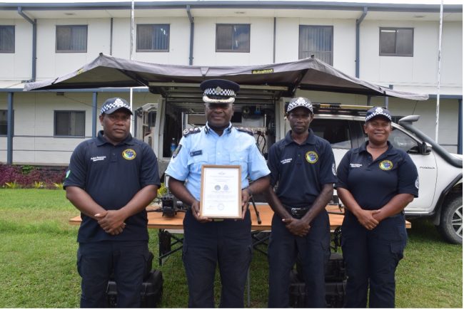 Supervising Commissioner Ian Vaevaso (Second from left) with Drone Support unit officers of the RSIPF