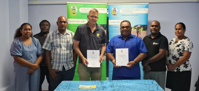 Minister Wasi and Dr Pollard after the signing ceremony.