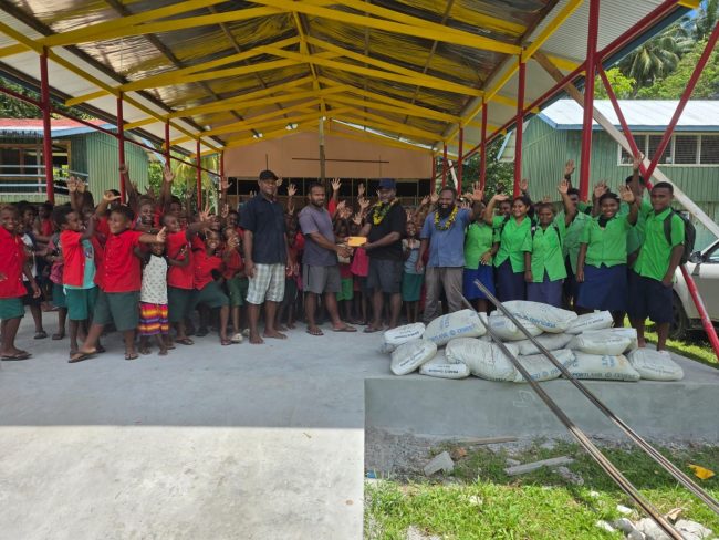 Afufu community High school staff and students receive the project materials from the North Malaita MP Daniel Waneoroa