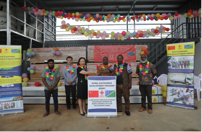 Counsellor Li Qinghua from the Chinese Embassy in the Solomon Islands hands over the project supplies to Honourable Nester Ghiro, Member of Parliament for Central Makira Constituency.