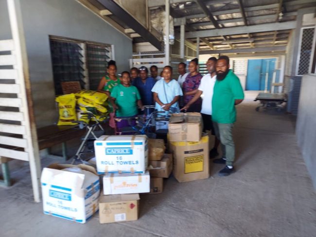 Community Development Officer of the North Malaita Constituency far right (Green shirt) delivering support to Maluu Clinic last month.