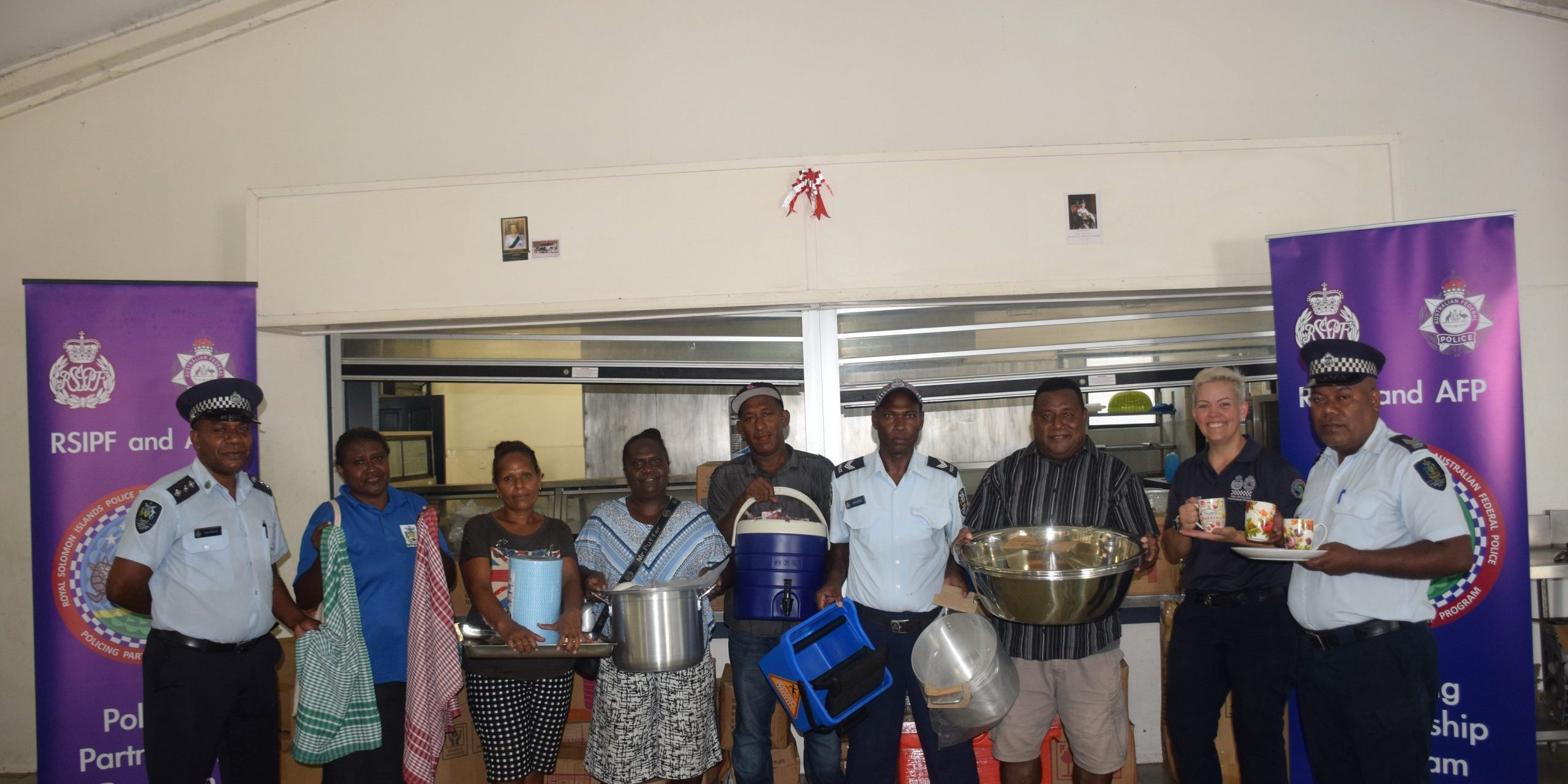 RAPPP advisor,RSIPF academy officers with the kitchen staffs showcase some of the donated items.