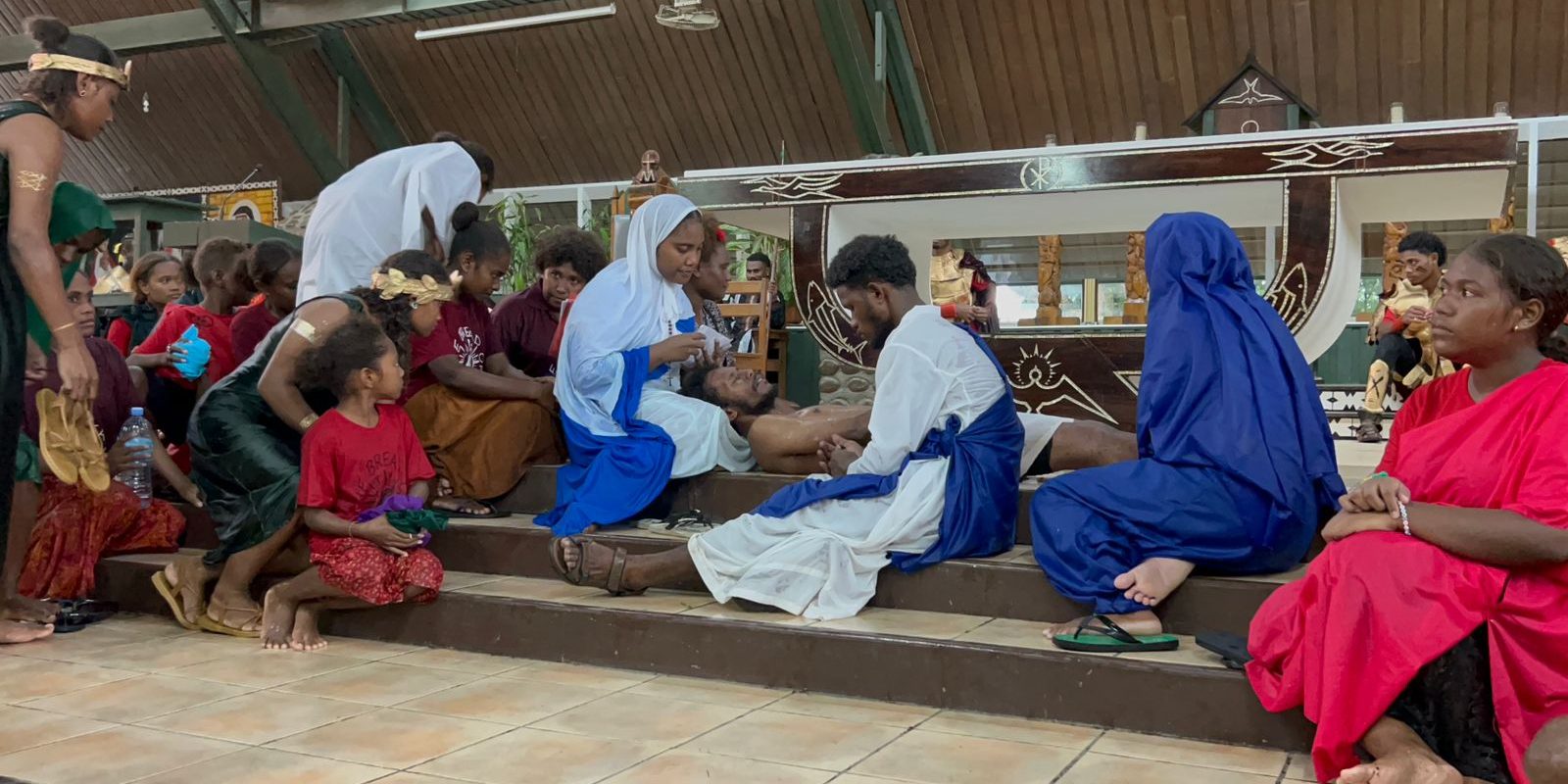 Jesus’ body is laid in a tomb, and His followers mourn, awaiting His resurrection reenacted by the Holy Cross youth on Good Friday 2026 (2)